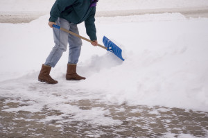 shoveling snow from sidewalk